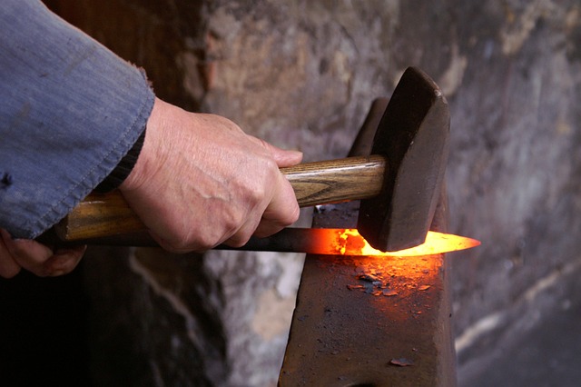 blacksmith hammering on anvil